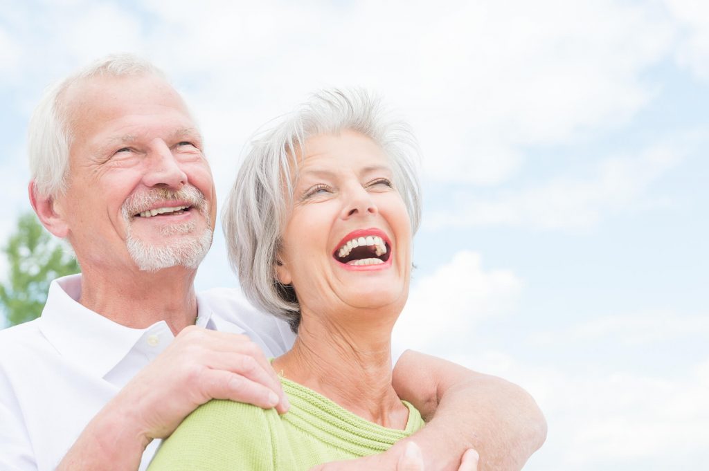 646c5c05d3865218312928d8 a happy senior couple with Dental Implants in Englewood CO