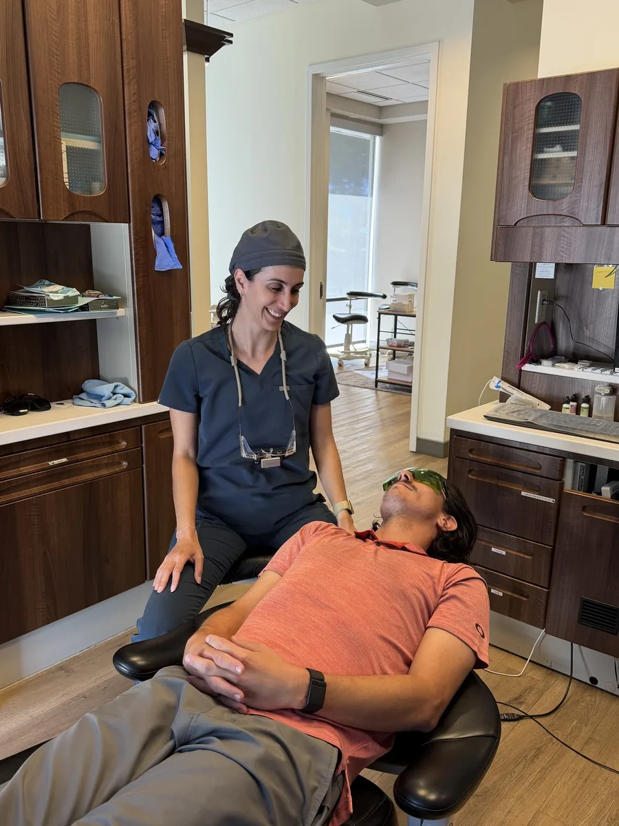 Dr. Golnaz Samimifar with a patient in a treatment room at Sopris Smiles